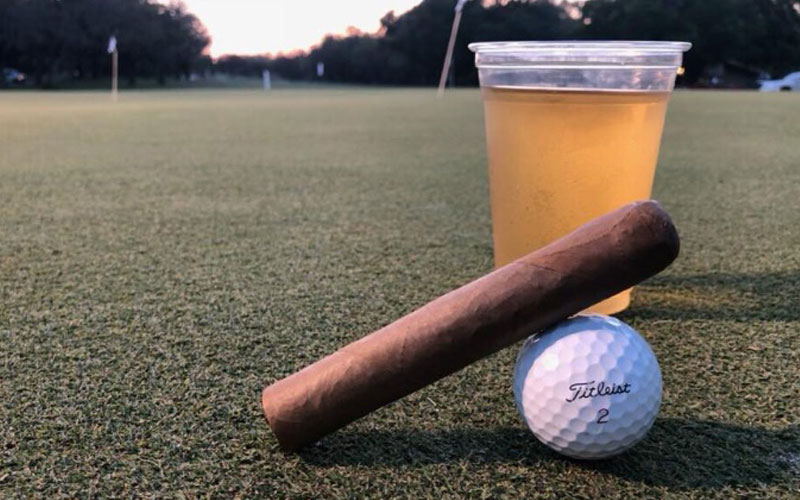 golf ball and beer on golf course